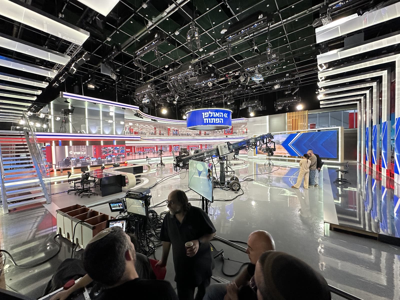 Open television studio with robotic cameras